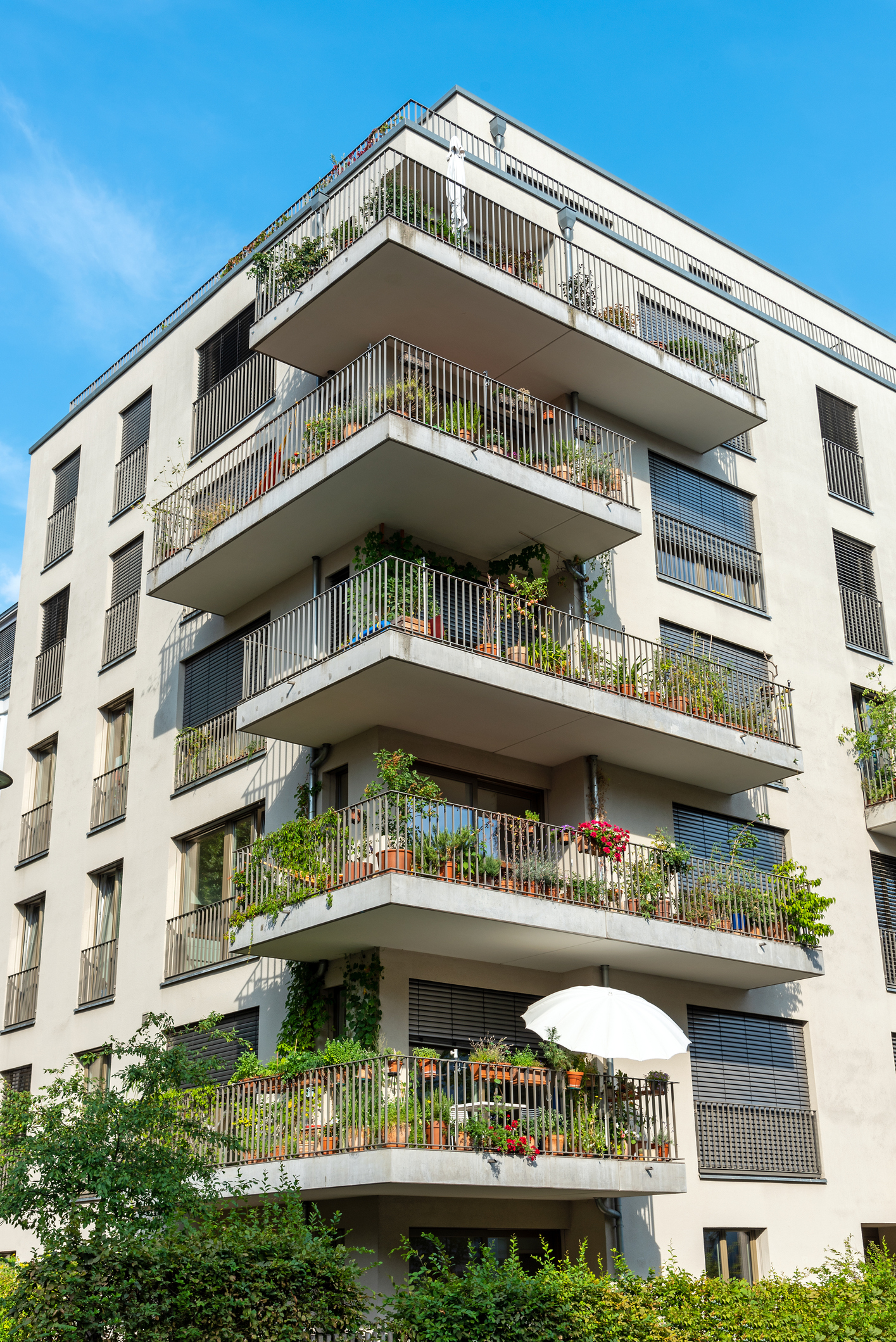 Gray multi-family house with balconies